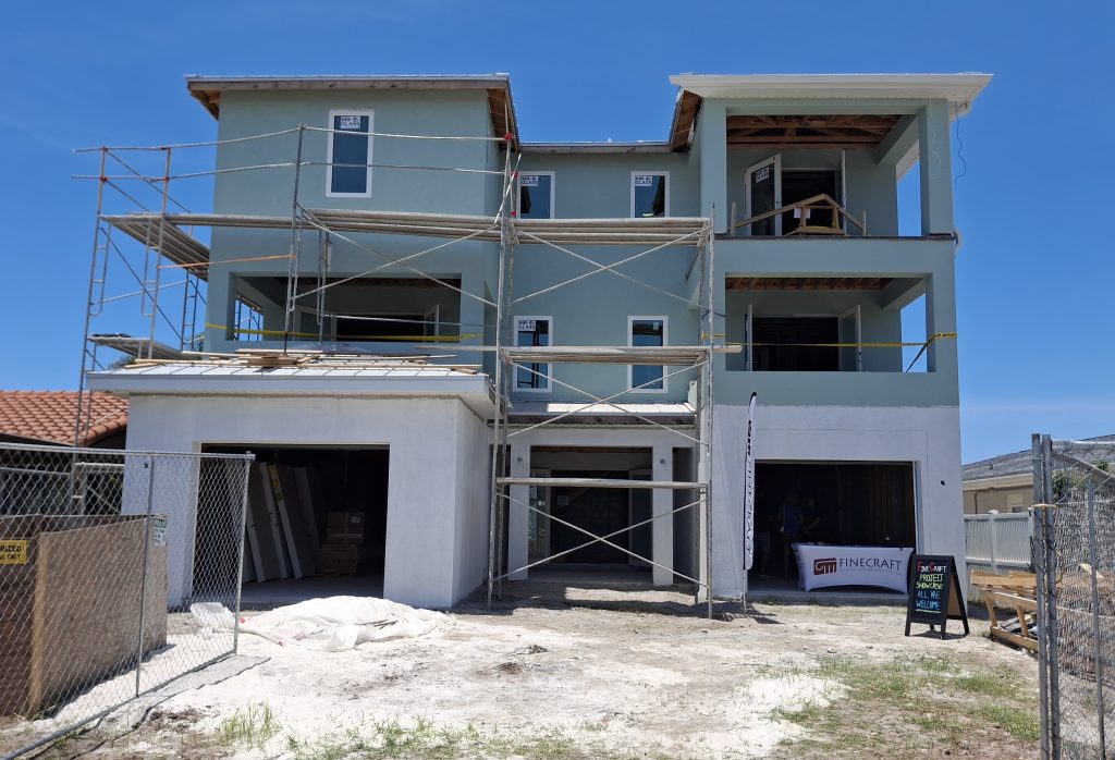 A newly constructed coastal home in Pinellas County under renovation, representing local rebuilding and housing recovery efforts.